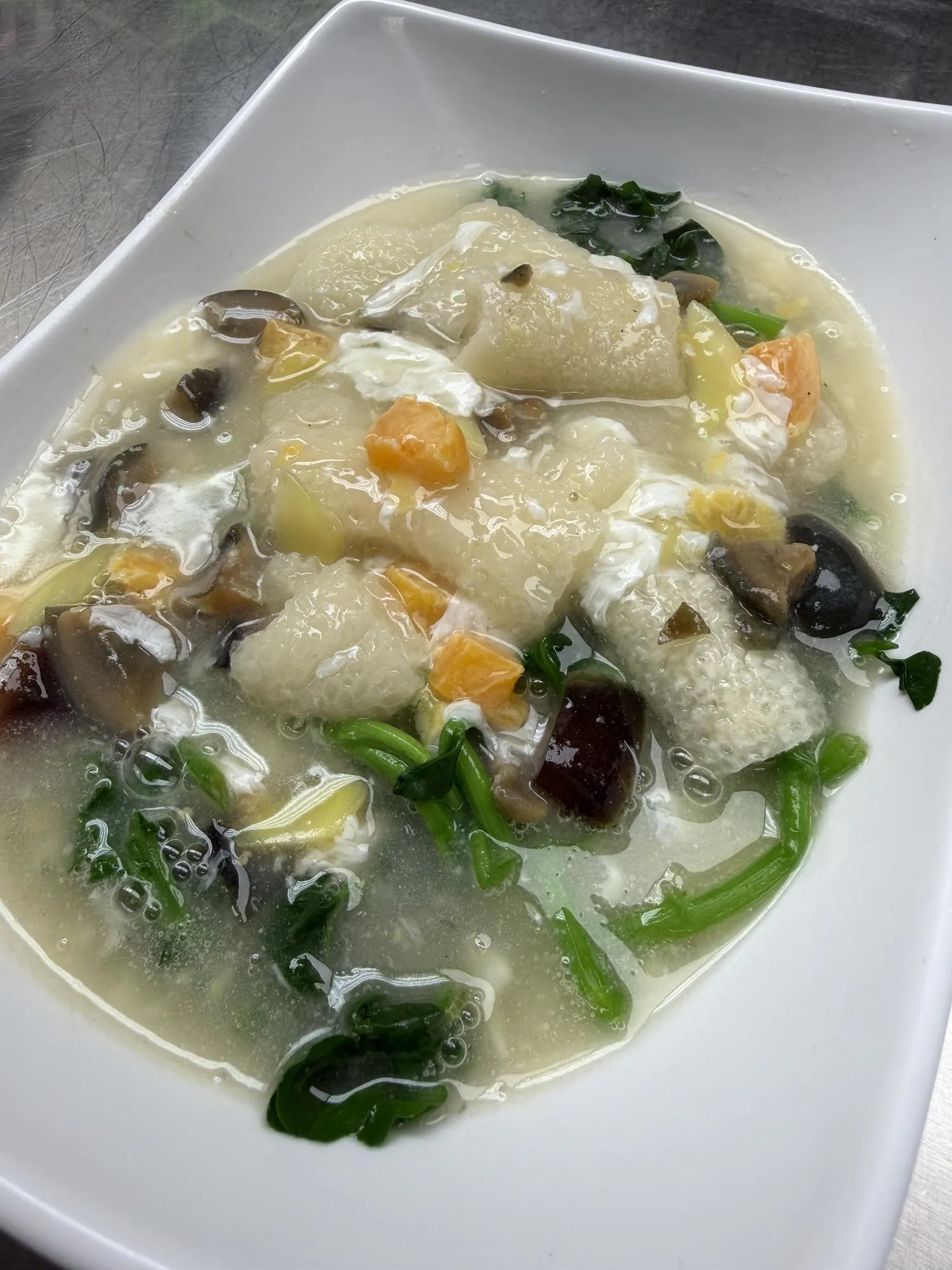 Fish maw soup with mushrooms and greens at Destination Café E Ramen, a Hong Kong-Style Cafe in Chicago