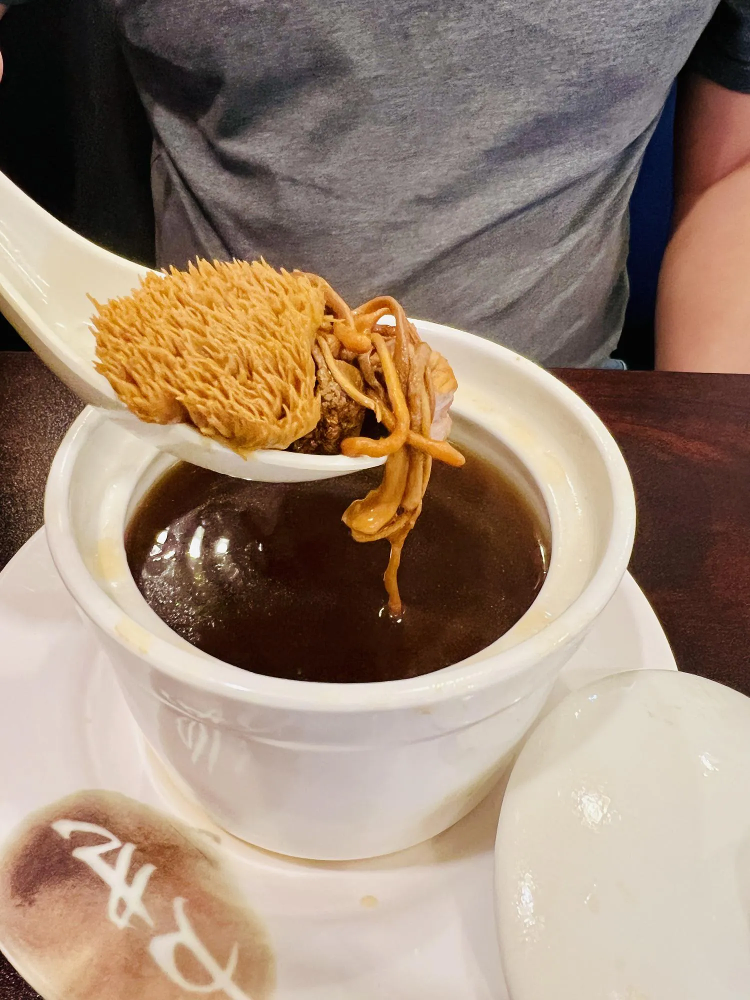 Herbal soup with lion's mane and cordyceps at Destination Café E Ramen, a Hong Kong-Style Cafe in Chicago